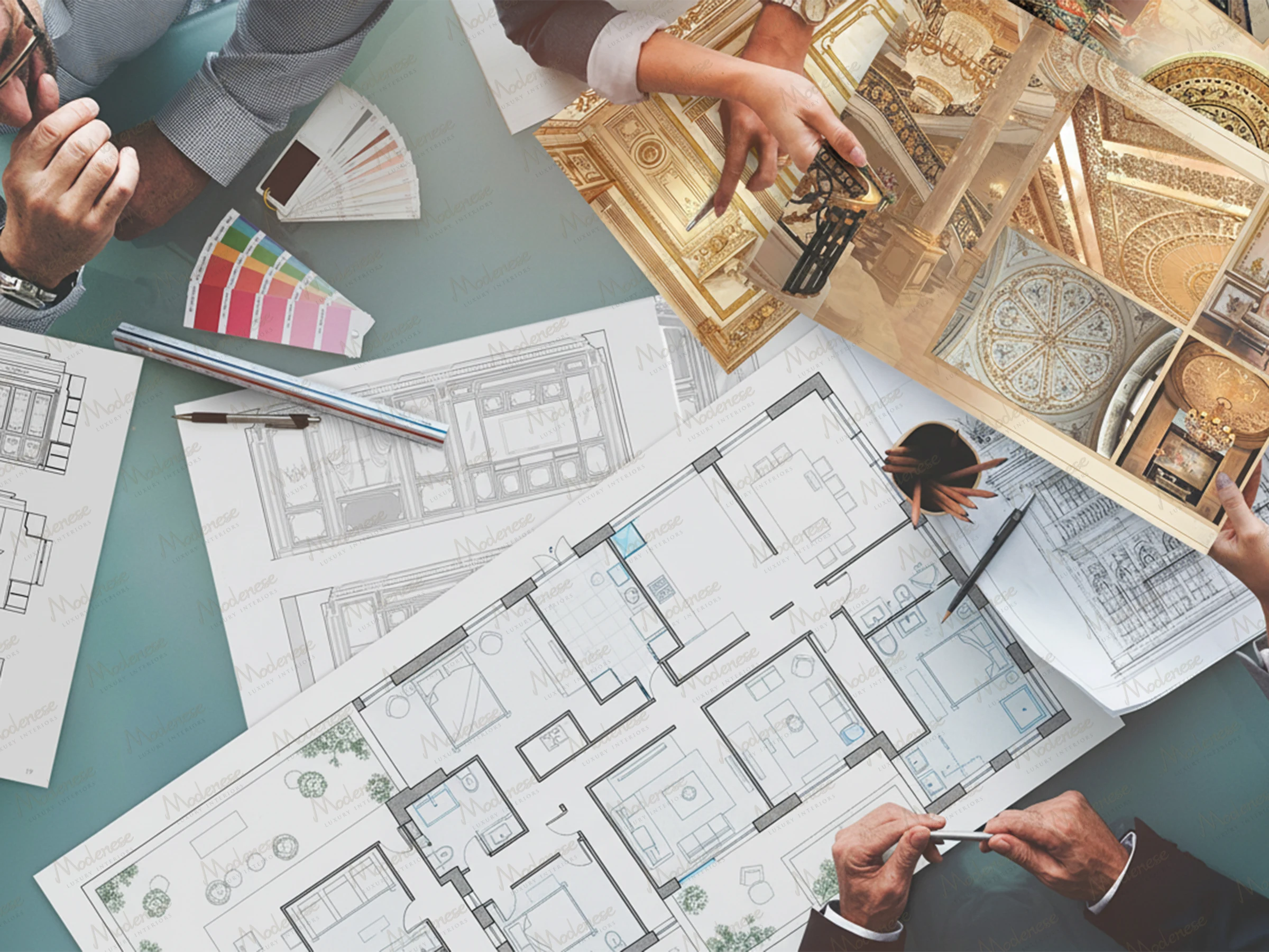 Interior design planning session in Dubai with architects reviewing floor plans, color swatches, and luxury project references on a glass table