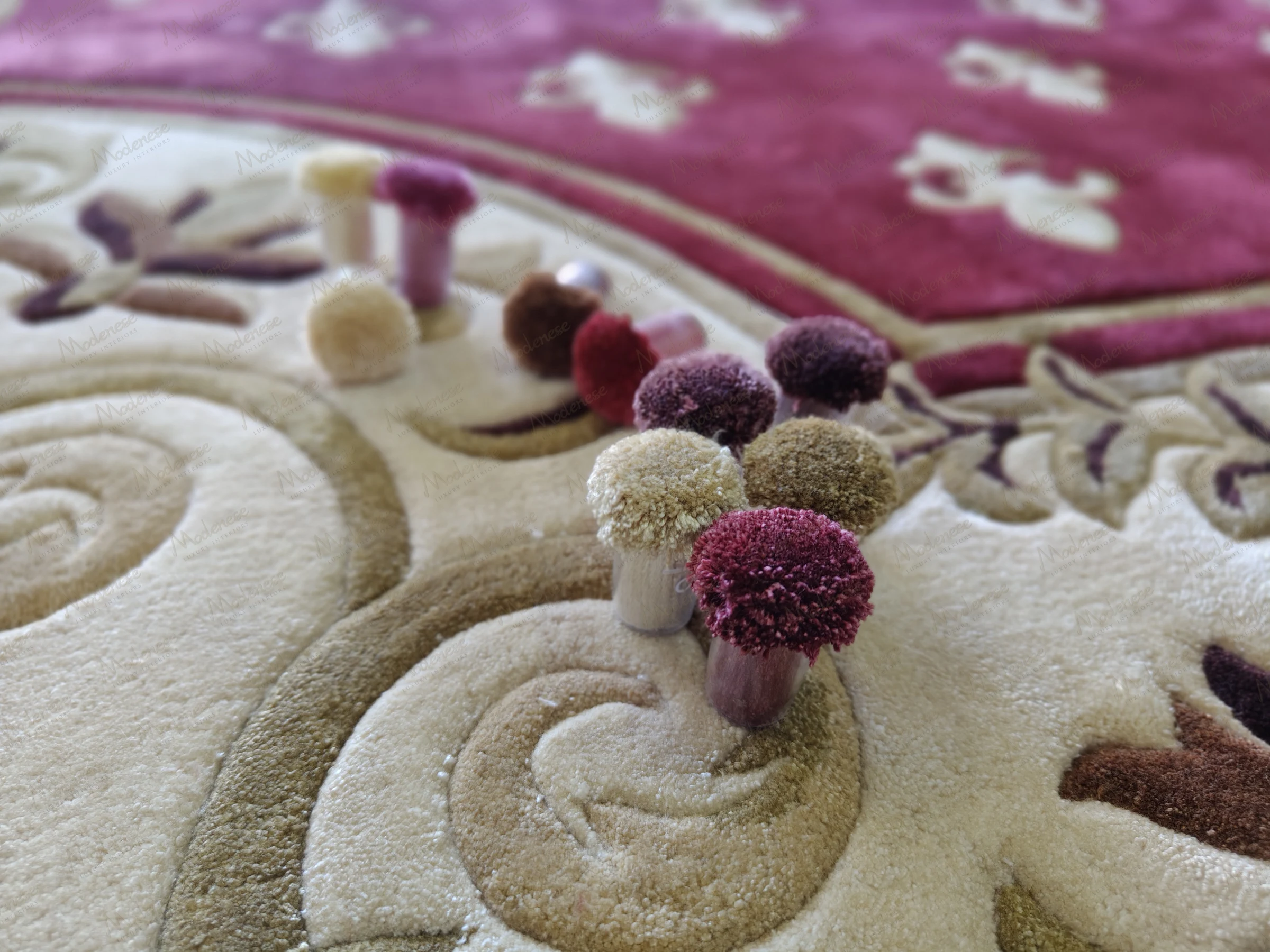 Close-up of carpet tuft samples in a Beirut villa showcasing custom yarn colors arranged on a plush, floral-patterned rug