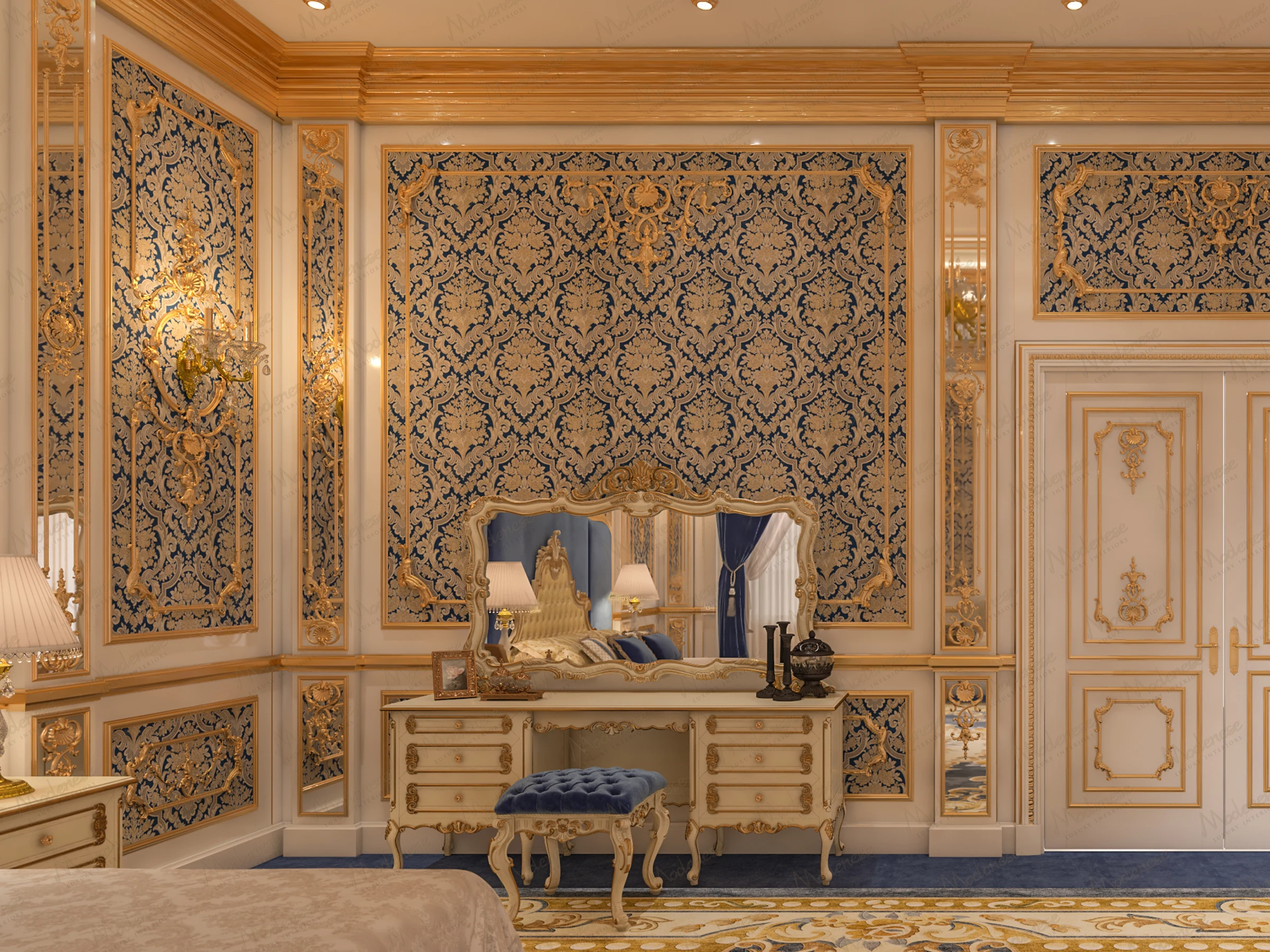Royal-style bedroom corner featuring a blue and gold vanity table, baroque wall detailing, and elegant wall sconces with a velvet bench