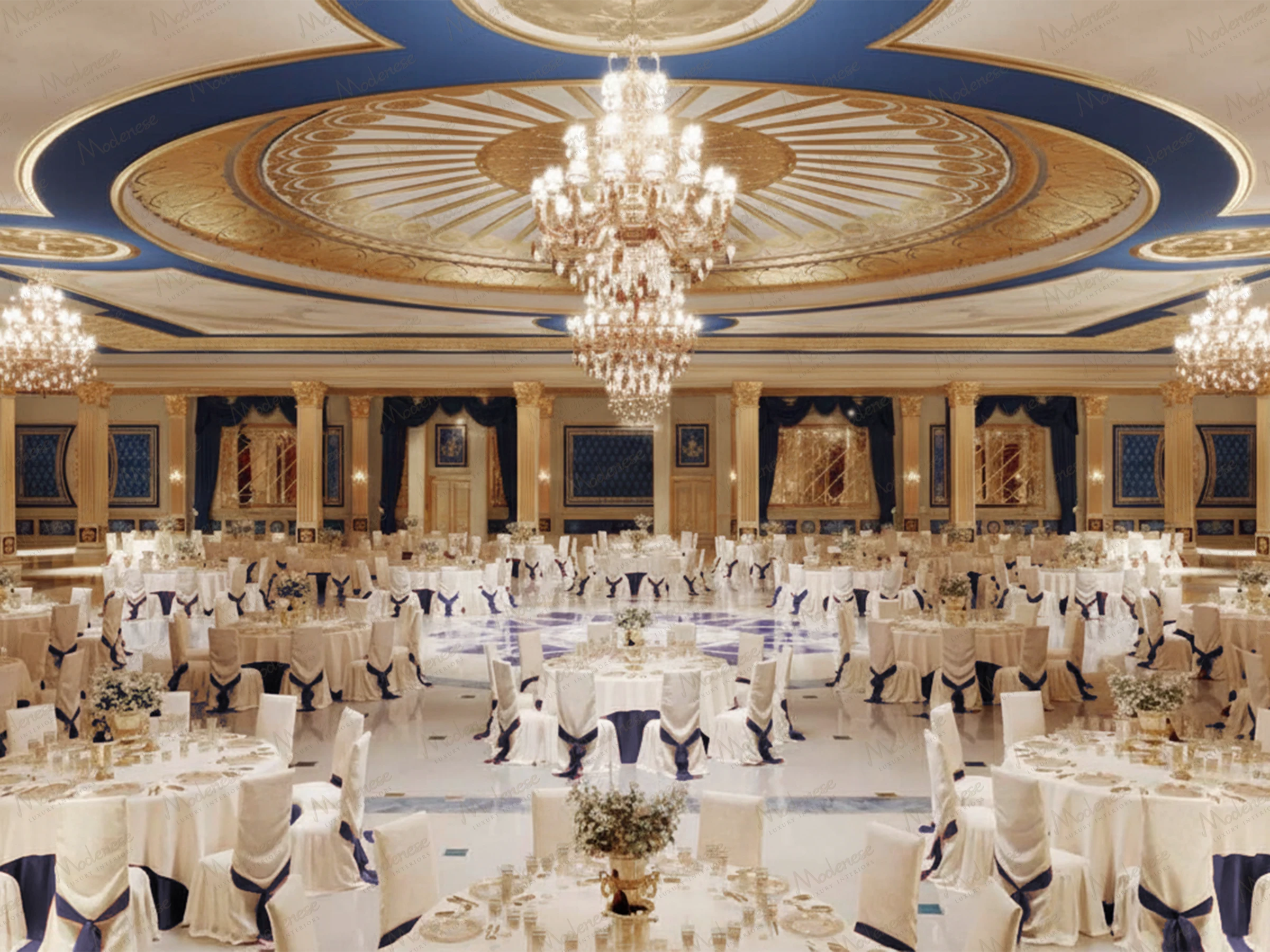 Grand banquet hall in Amman featuring gold and blue domed ceilings, crystal chandeliers, and round dining tables with white and navy-covered chairs