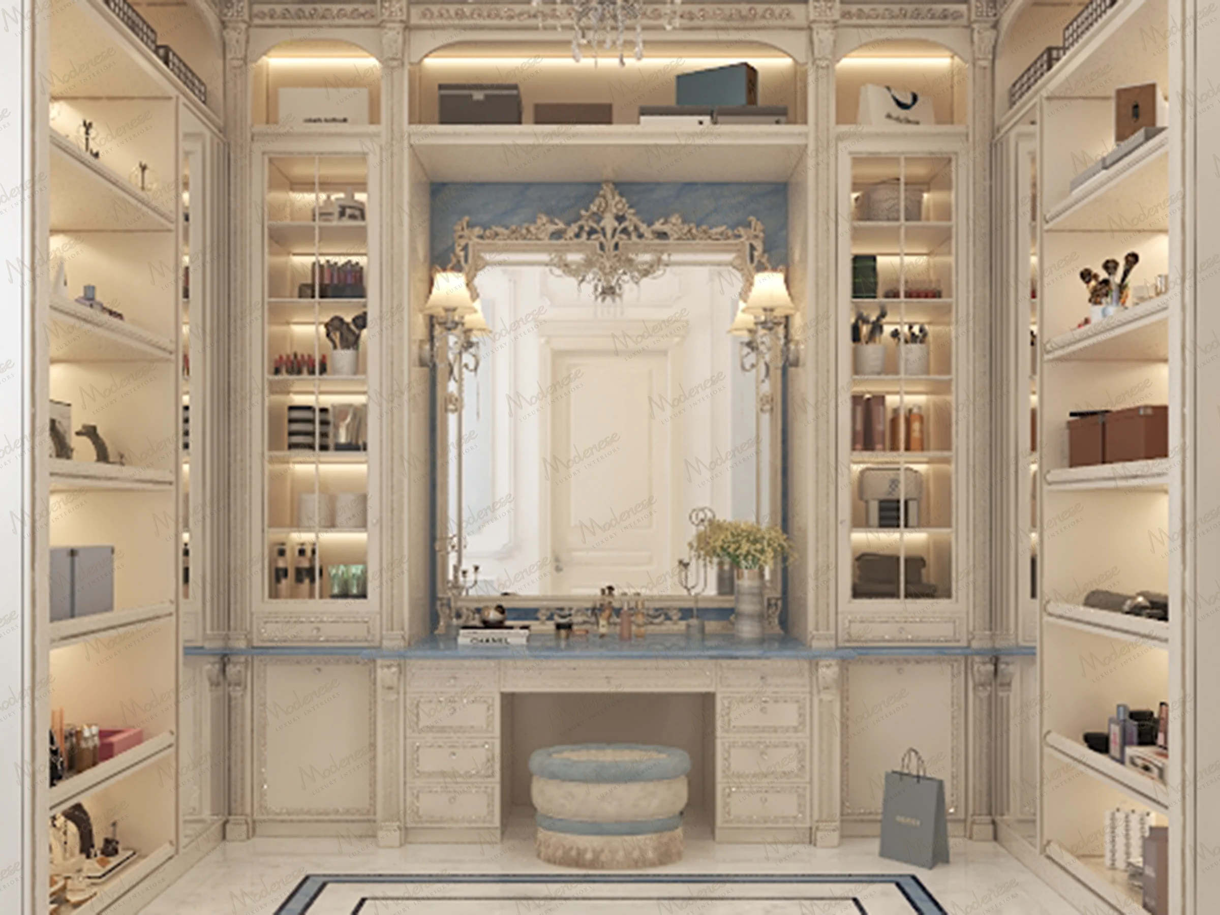 Sophisticated dressing table in a Rome closet with blue accents, glass cabinets, ambient shelf lighting, and a carved mirror flanked by wall sconces