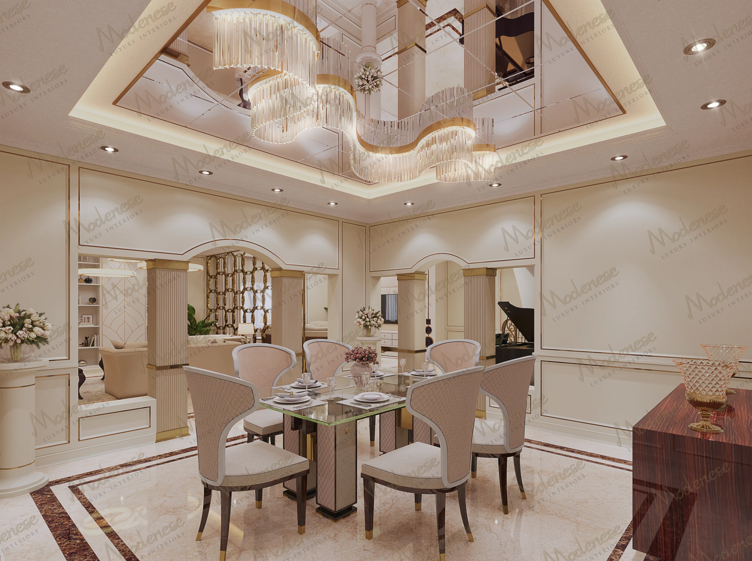 Elegant dining area in a luxury villa featuring a mirrored ceiling with a sculptural chandelier, marble flooring, and a glass-topped dining table with upholstered chairs