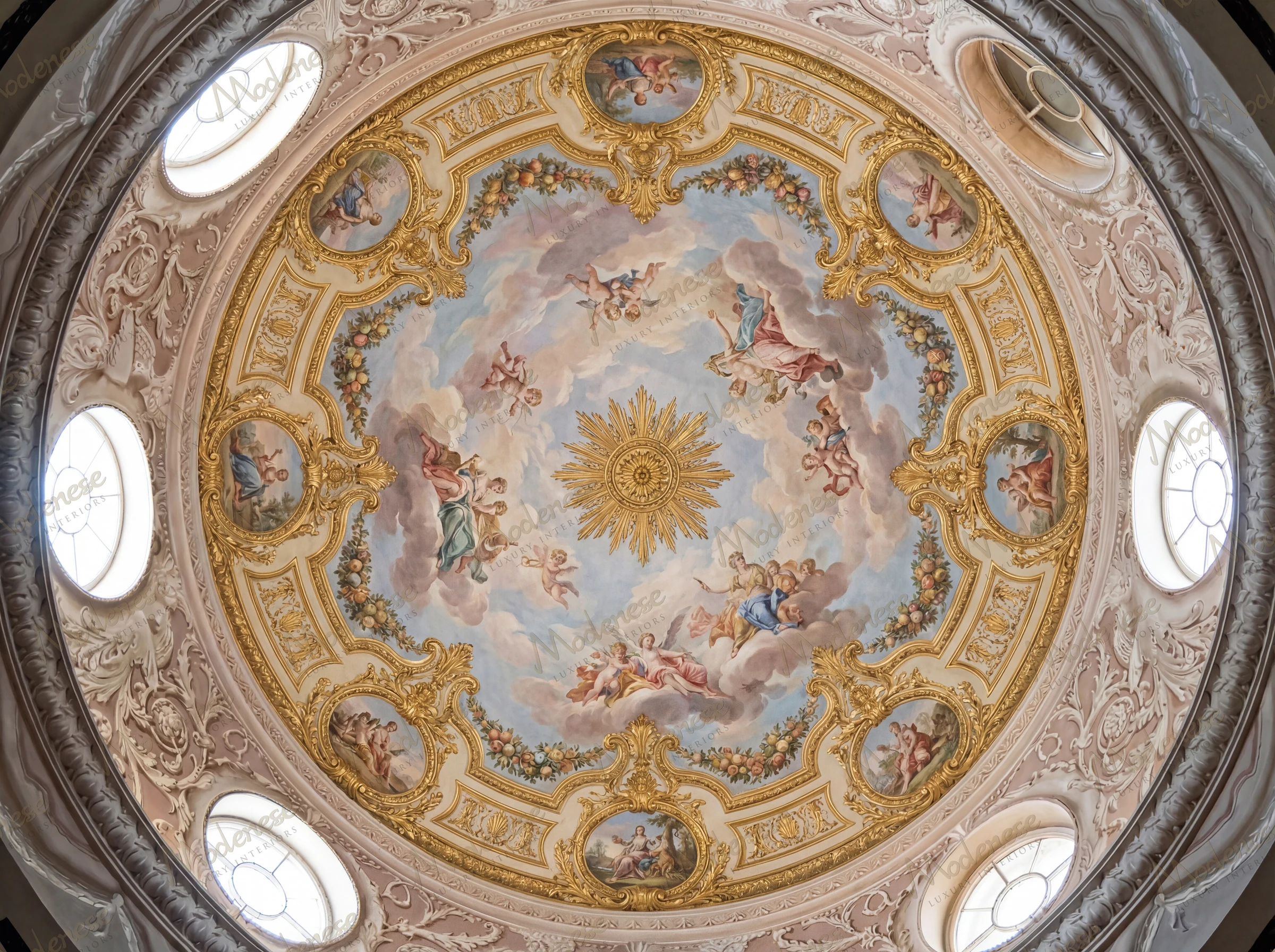 Baroque-style dome fresco in the Royal Palace with concentric clouds, radiant golden sunburst, cherubs, and richly gilded medallions