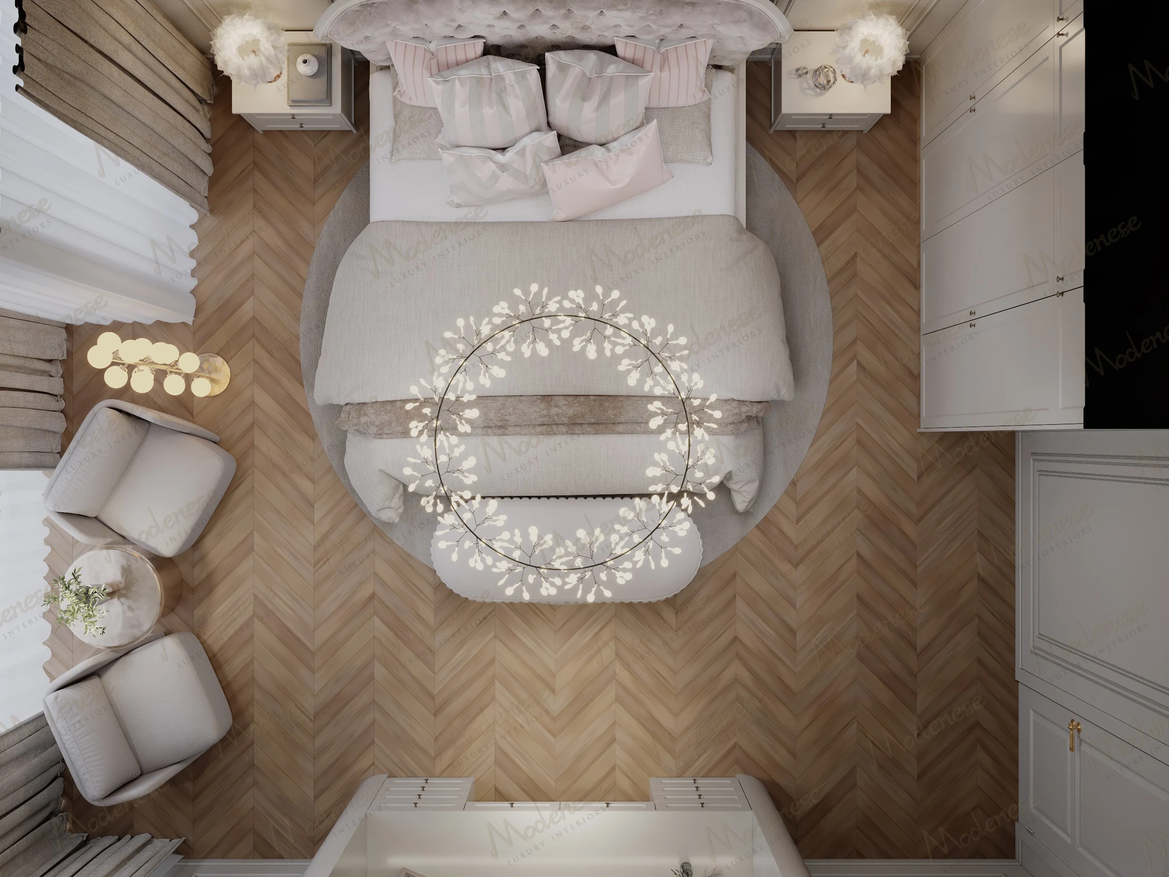 Overhead view of a refined Baghdad bedroom showcasing a symmetrical layout with circular rug, herringbone wood flooring, and a floral-inspired chandelier